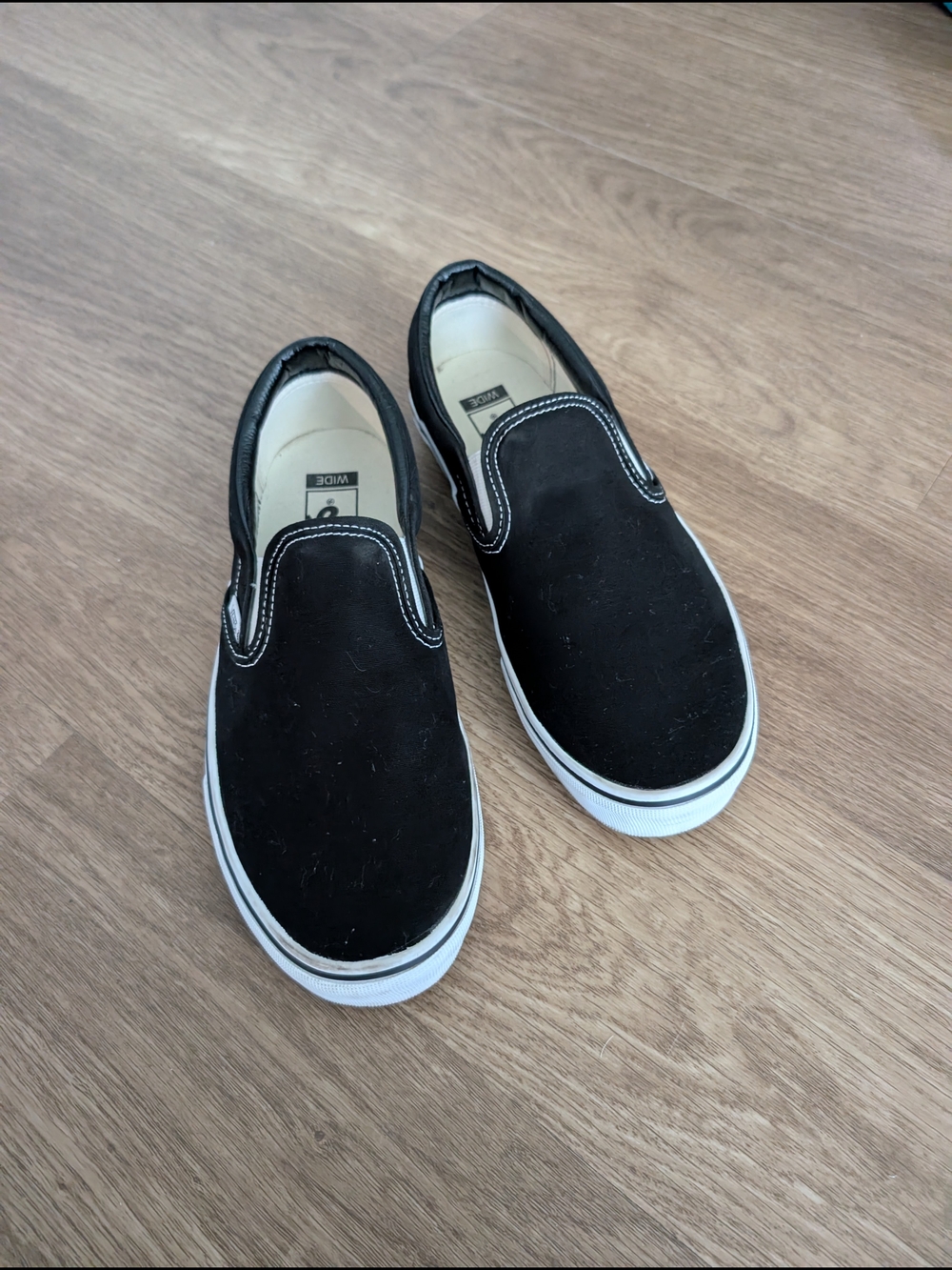 Vans Classic Slip-On Sneakers in Black and White 9 Wide